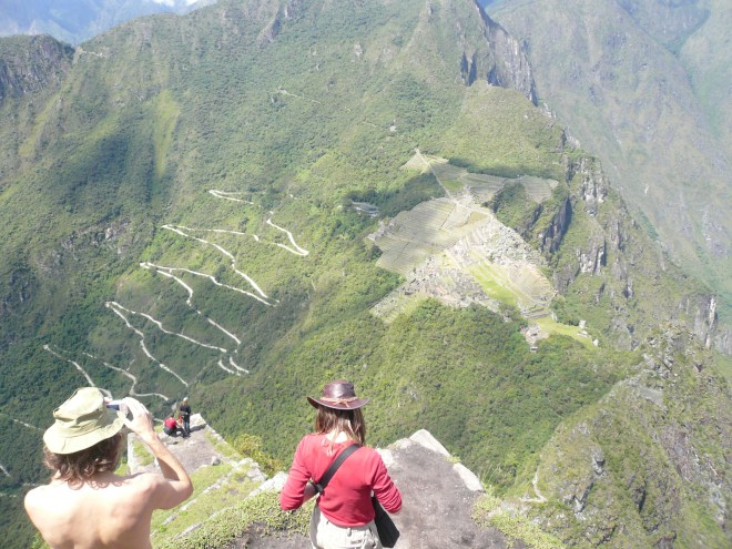 Machu Picchu and the pathway to the Gate of the Sun (far left), viewed from Waynu Picchu. The zig-zag road makes access easier, but detracts from the original. 