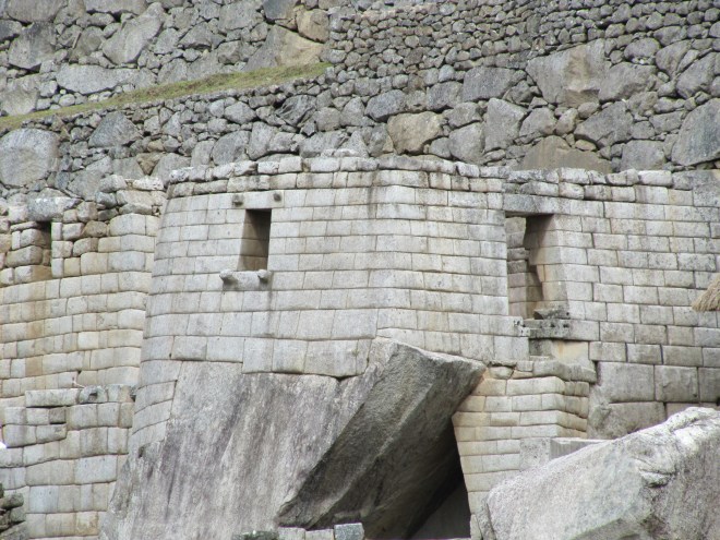 Buildings such as the Torreon at Machu Picchu were built around existing rocks. This image shows both the fine and coarser stone work of the Inka.