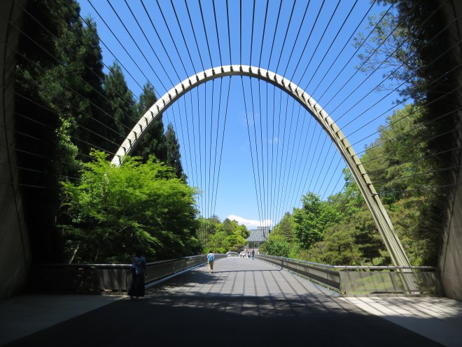 The Miho Museum in Shiga Prefecture Japan was designed by I.M. Pei, a Chinese-born American. The design of the entrance to the museum was inspired by the Chinese expression "Peach blossom spring beyond mortal world." When you emerge from the tunnel that leads to the museum you see a grand space with the buidlings embedded in the mountain.