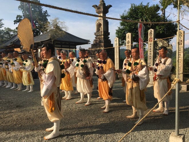 During the fire ceremony shugenja either side of the fire chant and shake their shakujo, a short stick with rings. The sound is mesmerising.